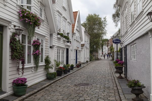 Cobbled Street And Whte Wooden Buildings