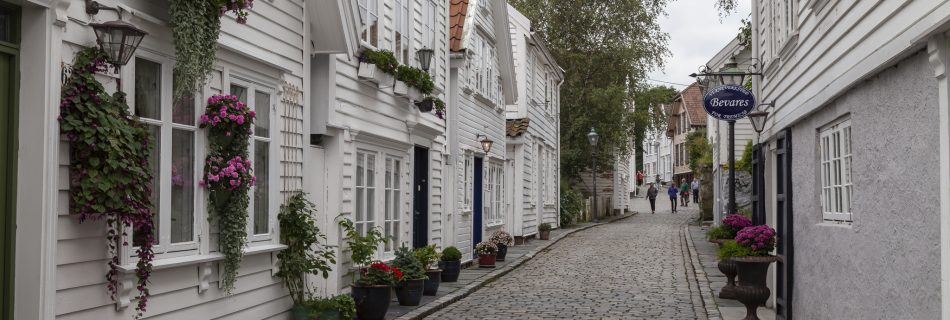 Cobbled Street And Whte Wooden Buildings