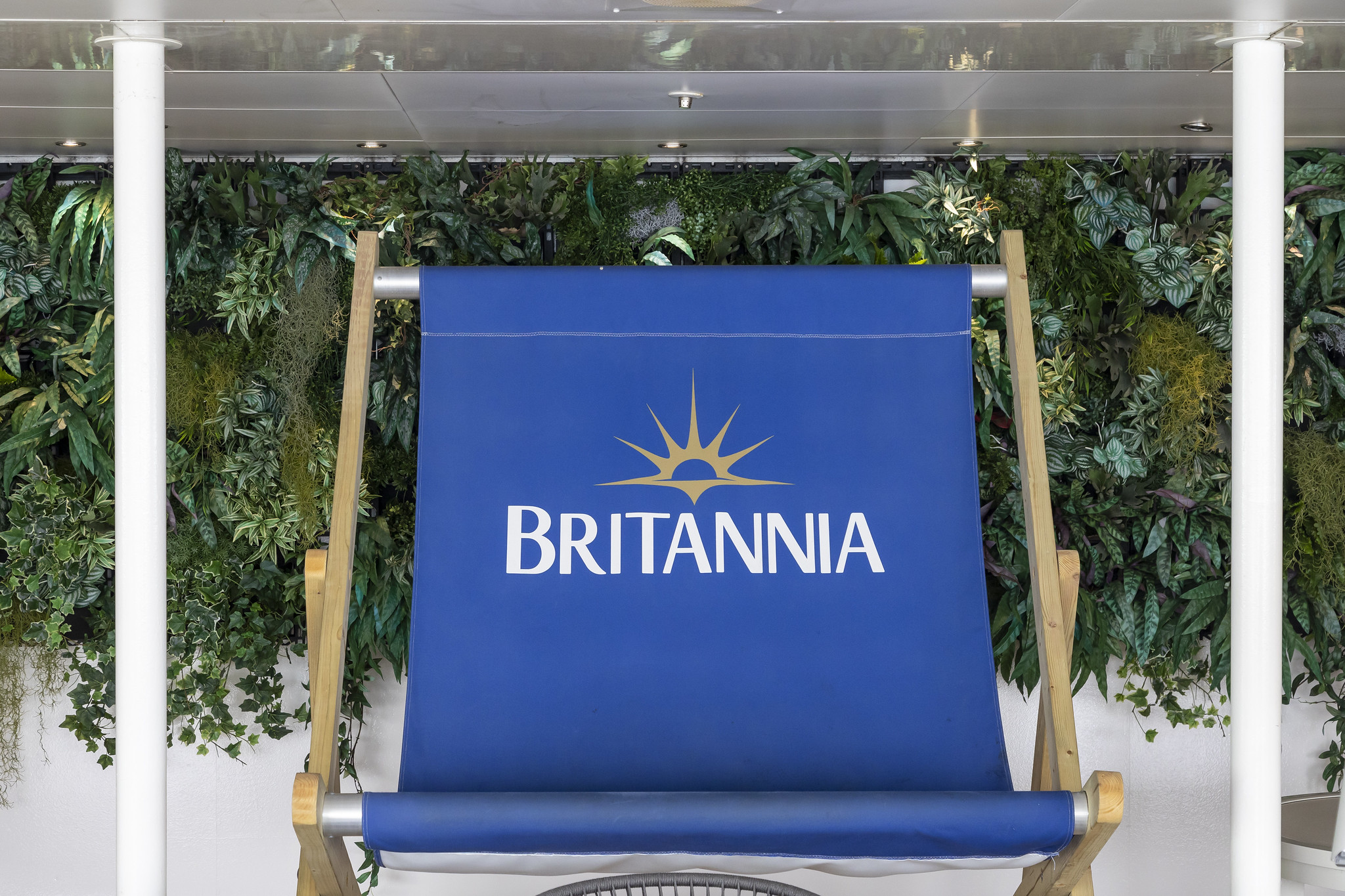 Oversized deck chair with Britannia logo on it.